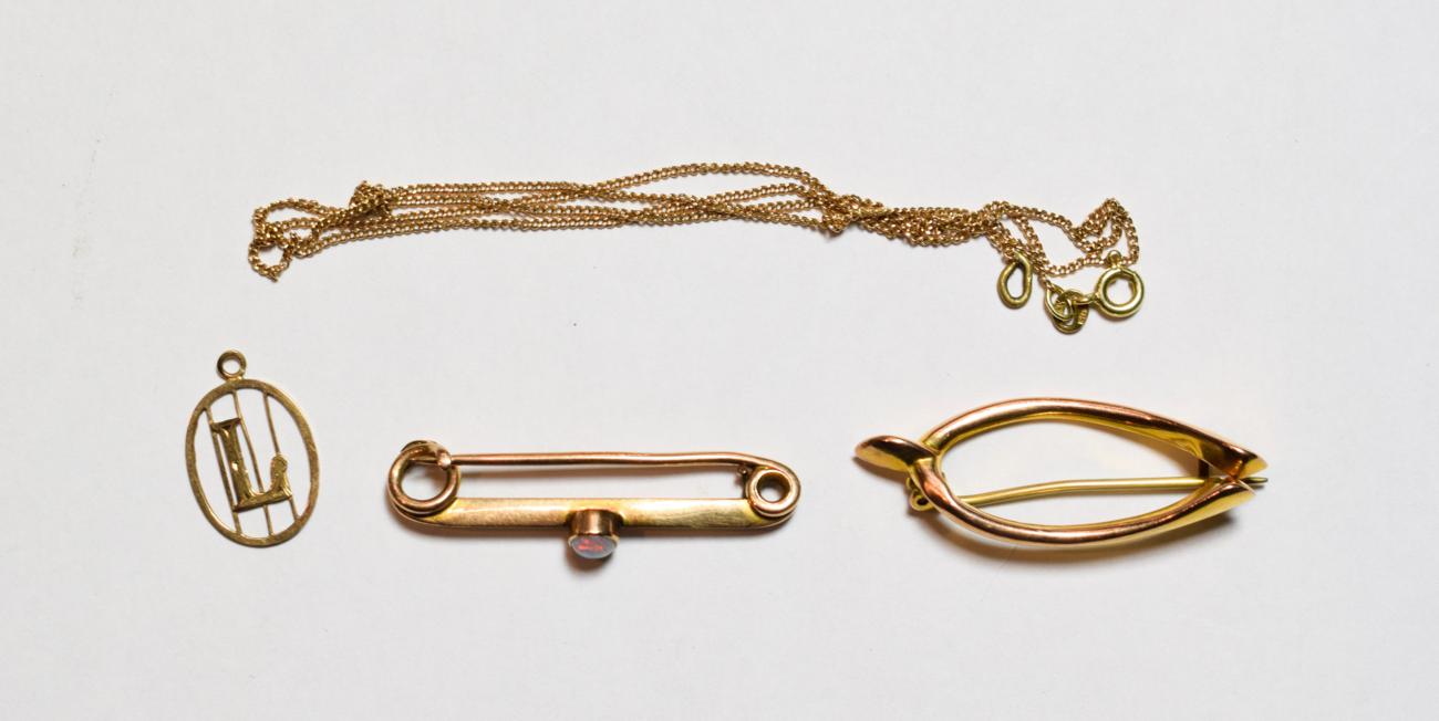 Lot 69 - Two brooches stamped '9CT'; a pendant stamped '9CT'; a 9 carat gold 'Long Service' pendant on a...