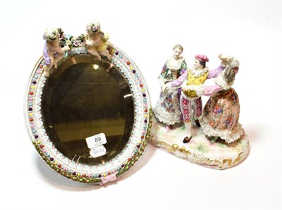Lot 89 - A 19th century porcelain figural group of three dancers; together with a porcelain easel mirror...