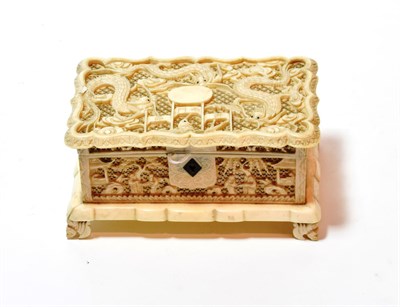 Lot 90 - A late 19th century Chinese Export ivory casket, pierced hinged lid with dragon design, pierced...
