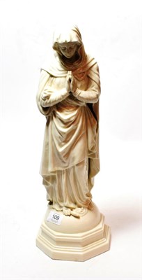 Lot 109 - A Belleek porcelain figure modelled as the Virgin Mary on a dome shaped stepped octagonal base,...