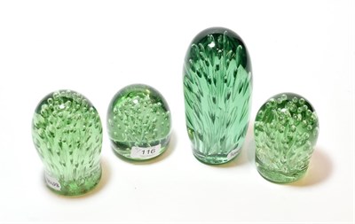 Lot 116 - Four Victorian green glass dumps with bubbles, largest 18.5cm
