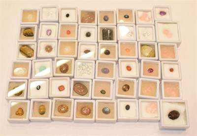 Lot 125 - A quantity of loose gemstones including rose quartz, tiger's-eye, mother-of-pearl, rock...