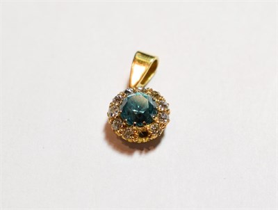 Lot 141 - A blue topaz and diamond cluster pendant, length 1.9cm   NB: one diamond loose but present