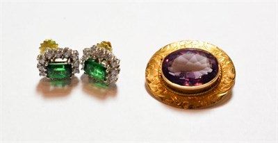 Lot 145 - An amethyst brooch, unmarked, length 2.4cm; and a pair of paste set earrings