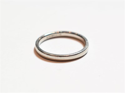 Lot 148 - A platinum band ring, finger size M