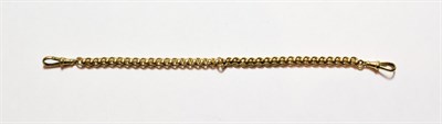 Lot 149 - A rollerball bracelet, stamped '9KT', length 21cm