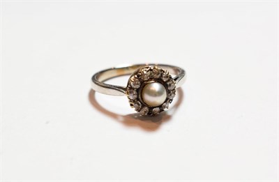 Lot 151 - A cultured pearl and diamond cluster ring, stamped '9CT', finger size P