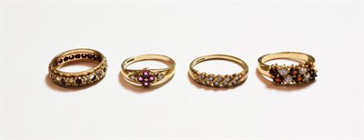 Lot 155 - A 9 carat gold diamond ten stone ring, finger size R1/2; a 9 carat gold pink stone and diamond...