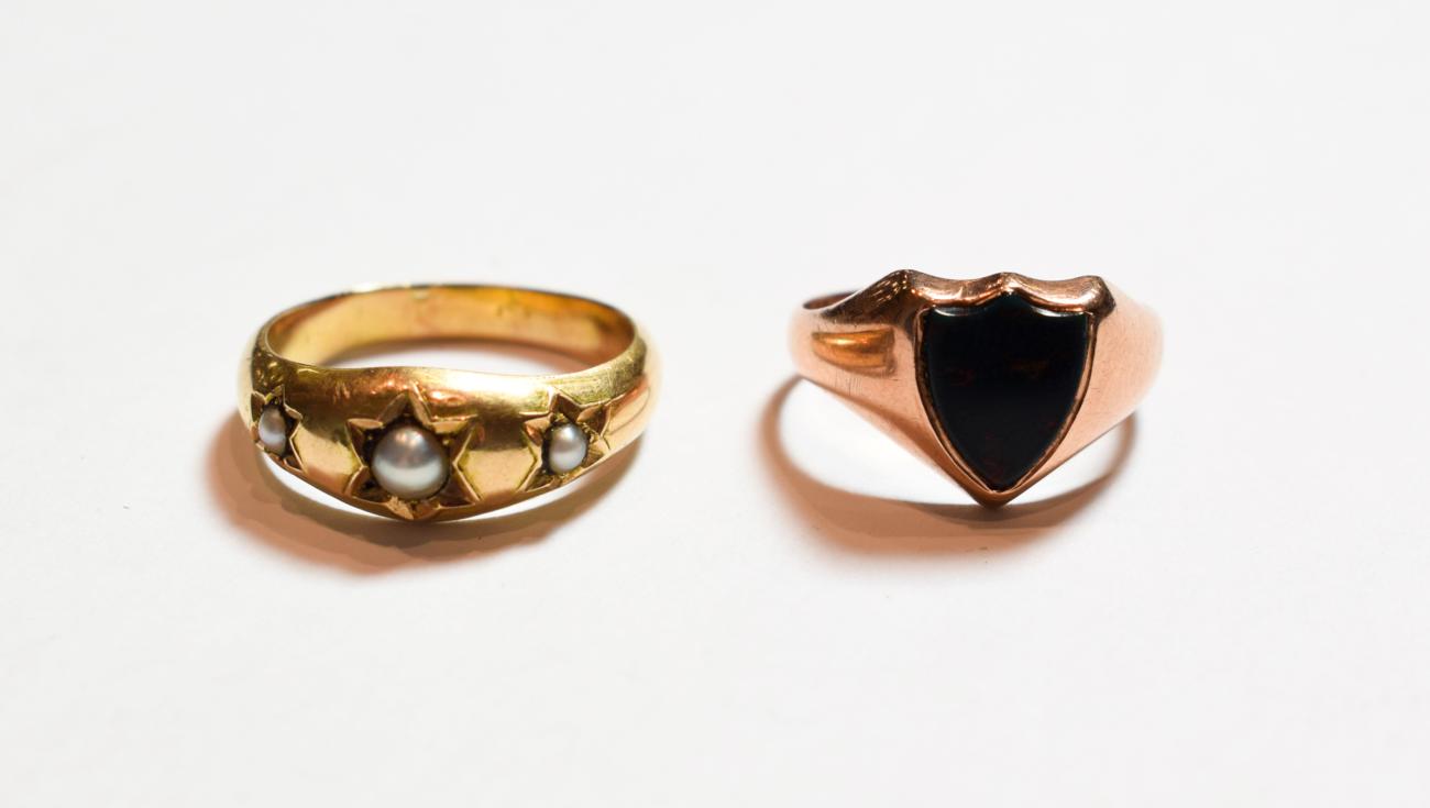 Lot 158 - A 9 carat gold bloodstone signet ring, finger size P; and a three pearl ring, unmarked, finger size
