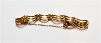 Lot 171 - A triple row bracelet, stamped '9CT', length 18.5cm