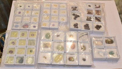 Lot 178 - A quantity of loose gemstones including citrines, amethysts, smoky quartz, tiger's-eye, rock...
