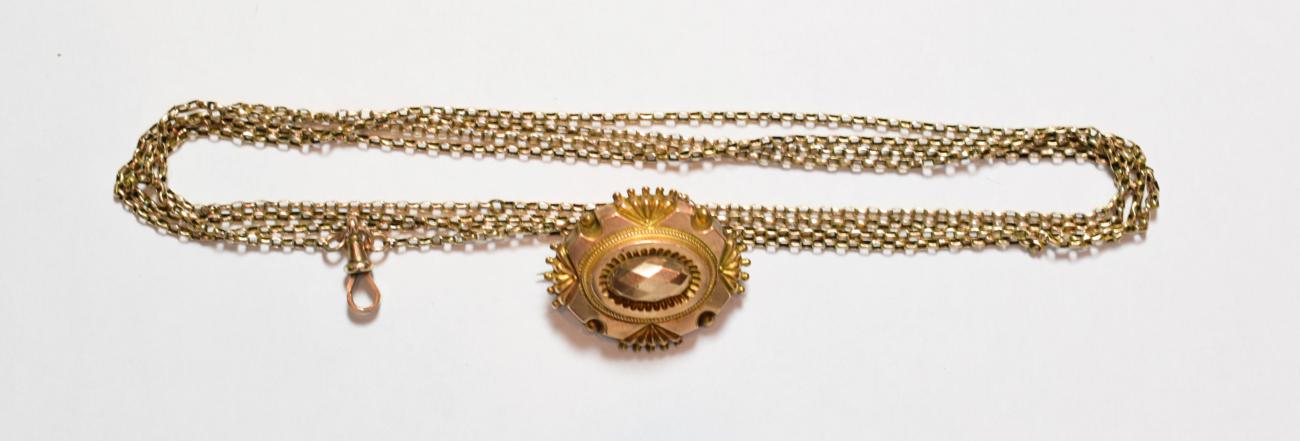 Lot 184 - A muff chain stamped '9CT', length 152cm; and a mourning brooch, stamped '10C', length 3.5cm