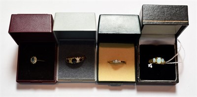 Lot 193 - A 9 carat gold opal ring, finger size M1/2; a 9 carat gold diamond nine stone ring, finger size...
