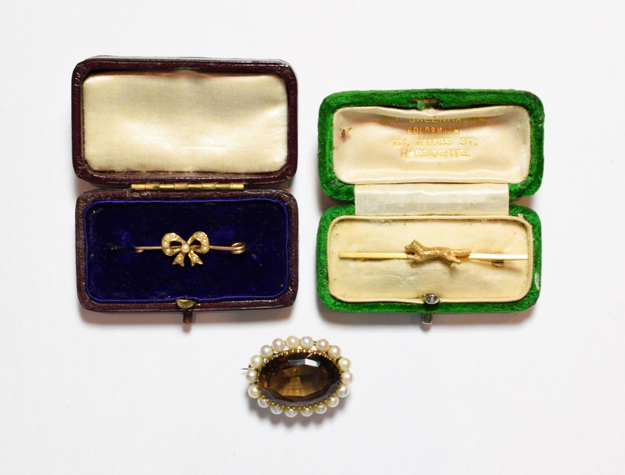 Lot 199 - A 9 carat gold smoky quartz and cultured pearl brooch, length 3.0cm; a runny fox brooch,...