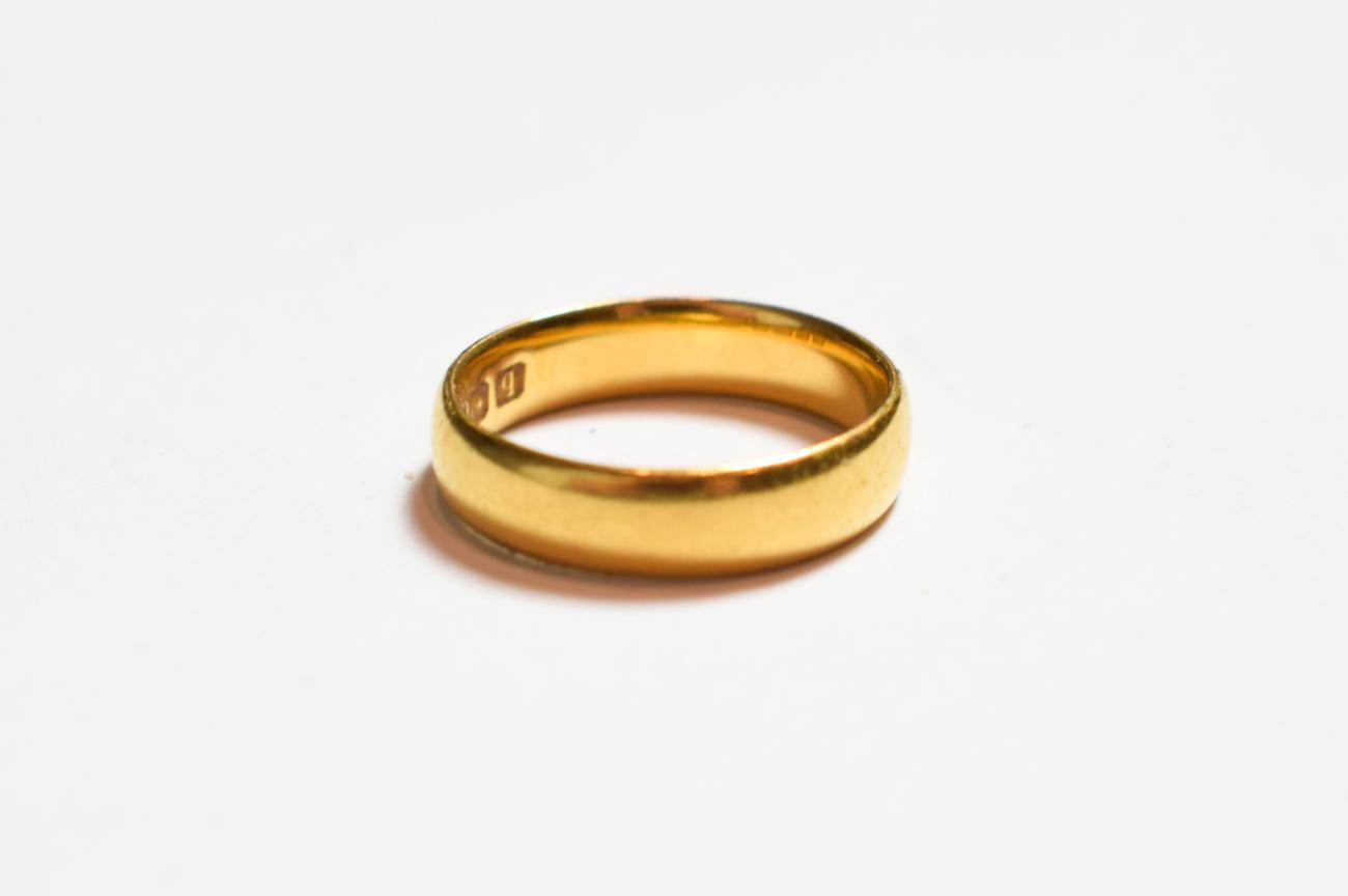 Lot 202 - A 22 carat gold band ring, finger size J1/2