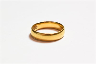 Lot 202 - A 22 carat gold band ring, finger size J1/2