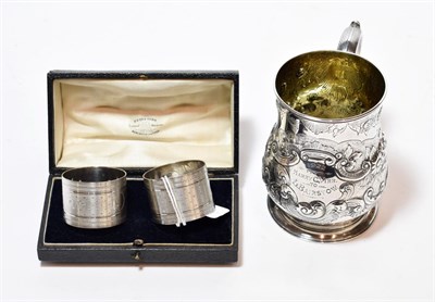 Lot 236 - A Victorian silver christening-mug, by Robert Hennell, London, 1875, baluster and on spreading...