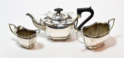 Lot 240 - A three-piece Edward VII silver tea service, by John Gilbert, Birmingham, 1906, each piece on...