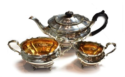 Lot 249 - A three-piece Victorian silver tea-service, by Charles Stuart Harris, London, 1898, retailed by...