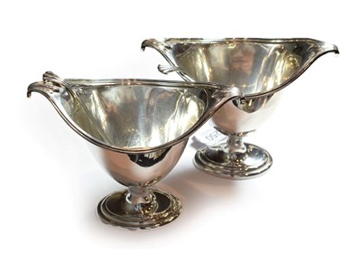 Lot 250 - A pair of George V silver sauce-tureens and ladles, by Thomas Bradbury & Sons Ltd., Sheffield,...