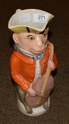 Lot 271 - A 19th century Staffordshire Toby jug in the form of a monkey cellist