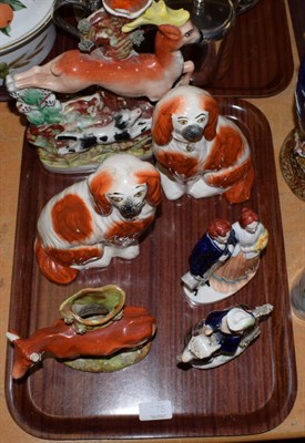 Lot 275 - A group of 19th century Staffordshire figures and models including: a pair of seated spaniels;...