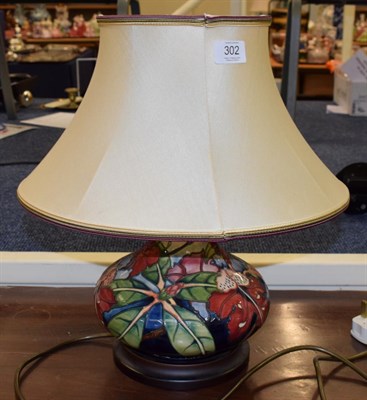 Lot 302 - A modern Moorcroft Simeon pattern lamp with original shade