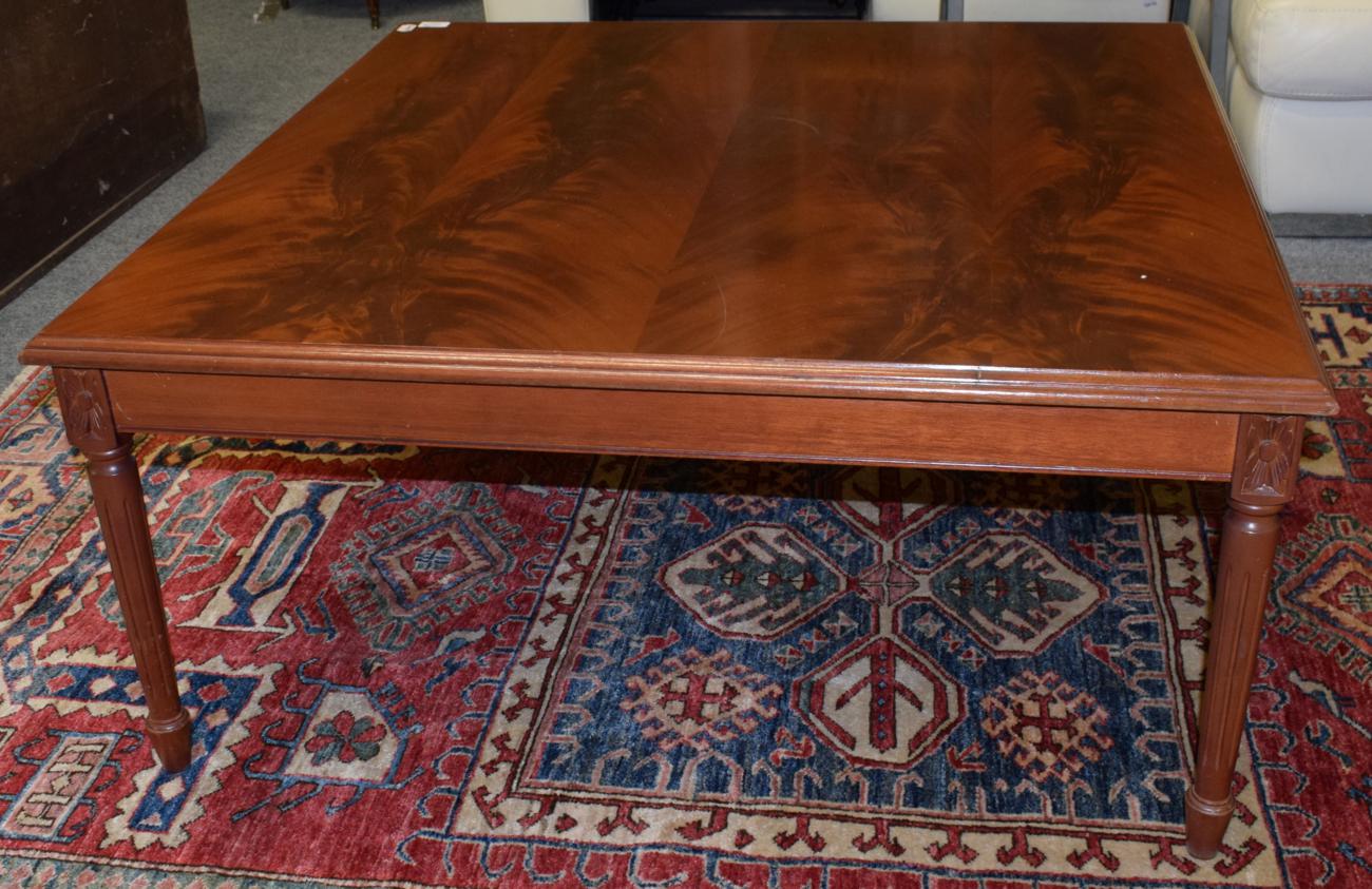 Lot 1079 - A reproduction mahogany coffee table