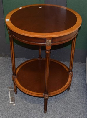 Lot 1081 - A reproduction mahogany Empire style two tier circular table