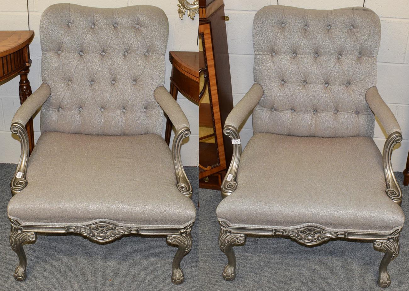 Lot 1090 - A pair of reproduction library armchairs covered in grey button fabric