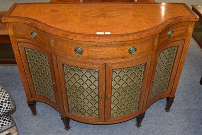 Lot 1103 - A reproduction inlaid walnut grille fronted sideboard/gramophone cabinet with serpentine front
