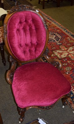 Lot 1106 - A Victorian walnut framed armchair upholstered in red buttoned fabric