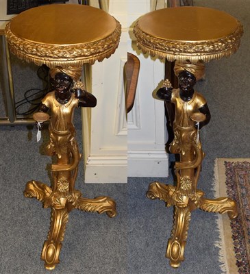 Lot 1109 - A pair of reproduction gilt decorated torcheres in the form of blackamoors