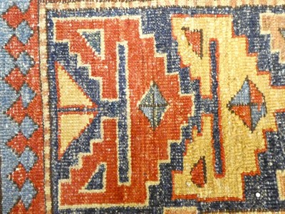 Lot 1123 - Afghan rug, the strawberry field with indigo panel and cruciform guls, enclosed by borders of...