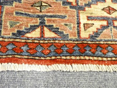 Lot 1123 - Afghan rug, the strawberry field with indigo panel and cruciform guls, enclosed by borders of...