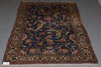 Lot 1124 - Kayseri rug, the indigo field of semi naturalistic flowers and vines enclosed by meandering...