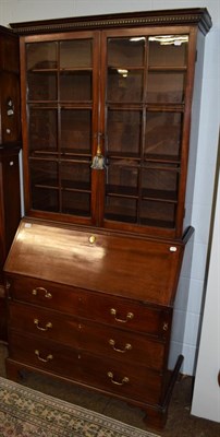 Lot 1144 - A George III mahogany bureau bookcase