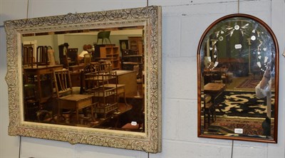 Lot 1152 - A 20th century mirror in moulded frame; together with another cut glass example (2)