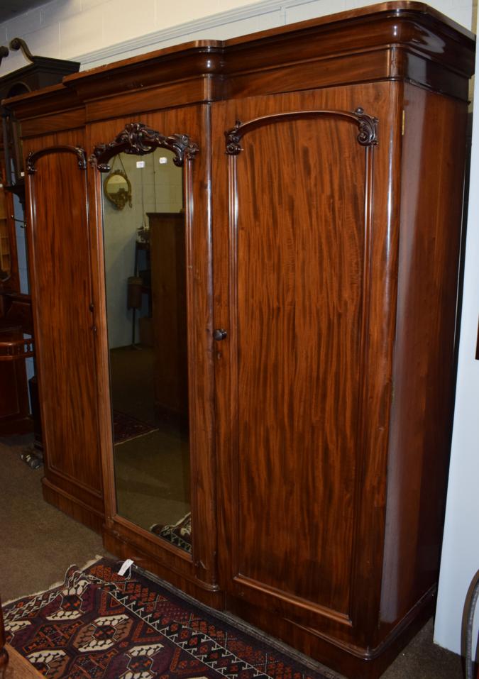 Lot 1158 - A Victorian mahogany triple door wardrobe