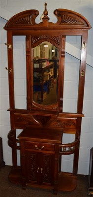 Lot 1160 - A reproduction carved and mirrored hall stand
