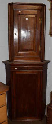 Lot 1162 - An early 19th century mahogany corner cabinet; together with a smaller oak example (2)
