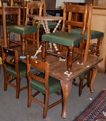 Lot 1173 - A Victorian oak extending dining table; a set of eight Victorian chairs; and a small bobbin leg...