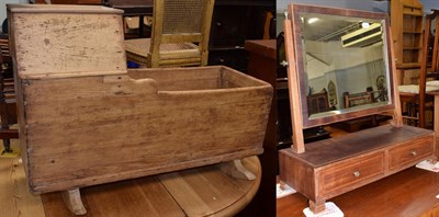Lot 1178 - A Victorian pine cradle; and a Victorian mahogany toilet mirror with two drawers (2)
