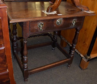 Lot 1187 - An 18th century oak side table with single drawer