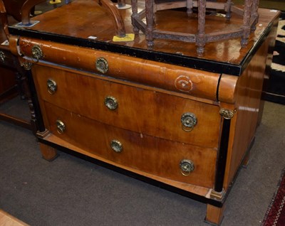 Lot 1188 - A mid 19th century Empire style part ebonised chest, the bow fronted drawers flanked by gilt...