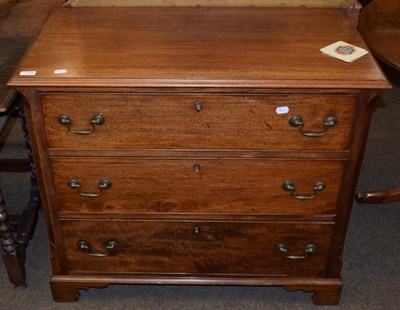 Lot 1194 - A George III style mahogany chest of drawers, with canted corners, three graduated drawers,...