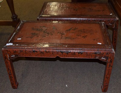 Lot 1198 - A pair of Chinese red lacquered coffee tables decorated with flowers