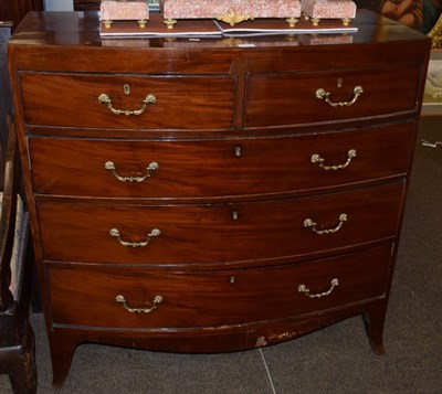 Lot 1203 - A George III mahogany bow fronted four height chest of drawers