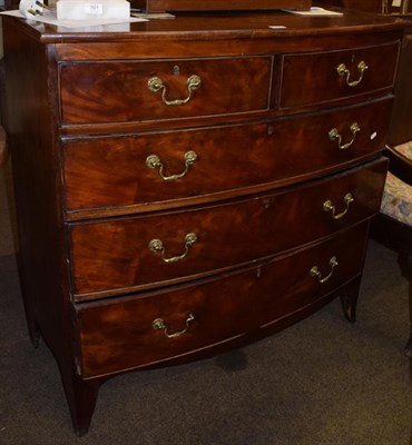 Lot 1205 - A George III mahogany bow fronted four height chest of drawers