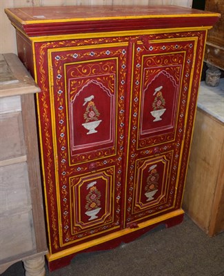 Lot 1229 - An Indian style red painted cabinet
